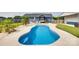 Inviting backyard featuring a freeform pool, surrounded by lounge chairs and tropical landscaping at 2268 Westbrook Rd, Edgemoor, SC 29712