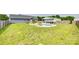 The backyard features an in-ground pool, a detached garage, green grass, and a full wooden fence at 2268 Westbrook Rd, Edgemoor, SC 29712