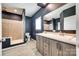 Modern bathroom features double sink vanity, neutral tiling, and walk-in shower with glass door at 2268 Westbrook Rd, Edgemoor, SC 29712