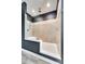 Bright bathroom features a spacious walk-in shower with neutral tiles, a built-in seat and glass door at 2268 Westbrook Rd, Edgemoor, SC 29712