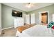 A primary bedroom with modern decor, soft natural light, an ensuite bathroom, and two closets at 2268 Westbrook Rd, Edgemoor, SC 29712