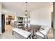 Open dining area with pendant lighting adjacent to the living room and modern kitchen at 2268 Westbrook Rd, Edgemoor, SC 29712