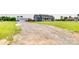 Exterior view of the home features a long driveway, garage, and a covered front porch at 2268 Westbrook Rd, Edgemoor, SC 29712