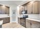 Close up of a kitchen featuring modern appliances, sleek cabinets, and a separate pantry at 2268 Westbrook Rd, Edgemoor, SC 29712