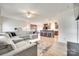 Open-concept living space featuring modern decor, a sectional sofa, and seamless flow to kitchen at 2268 Westbrook Rd, Edgemoor, SC 29712