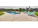 Backyard with in-ground pool, lounge chairs, palm trees, and fenced yard perfect for outdoor entertaining at 2268 Westbrook Rd, Edgemoor, SC 29712