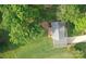 An aerial view shows a lush backyard, mature trees, and a well-maintained roof at 2728 Touchstone Cir, Newton, NC 28658