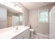 Bright bathroom featuring a white vanity, tile floors, and a window for natural light at 2728 Touchstone Cir, Newton, NC 28658