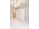 Bedroom with light walls, carpet flooring, and a double-door closet at 2728 Touchstone Cir, Newton, NC 28658
