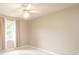 Bedroom with light walls, carpet flooring, and a large window with curtains at 2728 Touchstone Cir, Newton, NC 28658