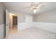 Neutral bedroom features carpet, a ceiling fan, baseboard trim and a double door closet at 2728 Touchstone Cir, Newton, NC 28658