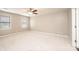 Bedroom featuring neutral walls, plush carpeting, two windows, and a ceiling fan at 2728 Touchstone Cir, Newton, NC 28658