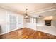 Bright dining room features hardwood floors, stylish light fixture and flows into living room at 2728 Touchstone Cir, Newton, NC 28658