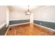 Dining area with hardwood floors, stylish light fixture and access to other rooms at 2728 Touchstone Cir, Newton, NC 28658