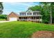 Charming two-story home featuring a welcoming front porch and well-manicured lawn at 2728 Touchstone Cir, Newton, NC 28658