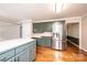 Spacious kitchen with stainless steel appliances, light countertops, and hardwood floors at 2728 Touchstone Cir, Newton, NC 28658