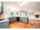 Open-concept kitchen featuring hardwood floors and flowing into the living area at 2728 Touchstone Cir, Newton, NC 28658