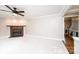 Comfortable living room with plush carpet, decorative fireplace and access to stairs at 2728 Touchstone Cir, Newton, NC 28658