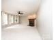 Bright open living room with plush carpet, cozy fireplace and lots of sunlight at 2728 Touchstone Cir, Newton, NC 28658