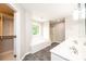 Bright bathroom features a large tub, separate shower, double vanity, and walk-in closet at 2728 Touchstone Cir, Newton, NC 28658