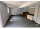 An unfinished basement with painted walls, a window and concrete floor awaits your touches at 286 Southside Rd, Rock Hill, SC 29730