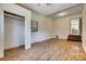 Bedroom with hardwood floors, a closet, and access to the kitchen area via painted stairs at 286 Southside Rd, Rock Hill, SC 29730