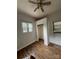 This cozy bedroom features hardwood floors, a ceiling fan, closet and natural light from a window at 286 Southside Rd, Rock Hill, SC 29730