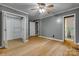 Bedroom featuring a spacious closet, hardwood floors, and a ceiling fan at 286 Southside Rd, Rock Hill, SC 29730