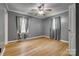 Bedroom with hardwood floors, a ceiling fan, neutral paint, and windows at 286 Southside Rd, Rock Hill, SC 29730