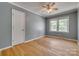 Bedroom features a ceiling fan, hardwood floors, and a large window at 286 Southside Rd, Rock Hill, SC 29730