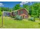 Charming brick home with a well-manicured lawn and lush landscaping at 286 Southside Rd, Rock Hill, SC 29730