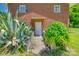 Pathway leads to a brick home, framed by mature plants and greenery at 286 Southside Rd, Rock Hill, SC 29730