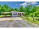 Home exterior featuring a covered parking area, a well maintained lawn, and mature trees at 286 Southside Rd, Rock Hill, SC 29730