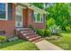 Brick home entrance with steps, complemented by mature greenery and a walkway at 286 Southside Rd, Rock Hill, SC 29730