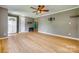 Large living room with wood flooring, ceiling fan, and access to other rooms at 286 Southside Rd, Rock Hill, SC 29730