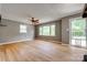 Sunlit living room with wood floors, neutral walls, and a classic ceiling fan at 286 Southside Rd, Rock Hill, SC 29730