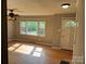 Inviting living room with hardwood floors, plenty of natural light, and a classic ceiling fan with lighting at 286 Southside Rd, Rock Hill, SC 29730