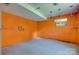 Basement room with orange walls and concrete floor at 286 Southside Rd, Rock Hill, SC 29730