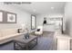Bright living room with modern decor, grey wood floors, and neutral tones for a relaxing atmosphere at 3232 Dannelly Towns Aly # 1006C, Charlotte, NC 28208