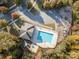 Aerial view showcasing the community pool, parking, and surrounding greenery creating a recreational oasis at 35 Dorie Dr, Belmont, NC 28012
