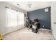 Bedroom with a home office setup, large window, ceiling fan and neutral carpeting at 35 Dorie Dr, Belmont, NC 28012