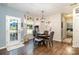 Dining area with dark wood floors and table, and view of outside patio at 35 Dorie Dr, Belmont, NC 28012