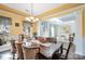 Formal dining room with a tray ceiling and hardwood floors offers a sophisticated space for hosting dinner parties at 35 Dorie Dr, Belmont, NC 28012