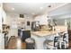 Bright eat-in kitchen features granite countertops, stainless steel appliances, and hardwood floors at 35 Dorie Dr, Belmont, NC 28012