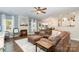 The living room features hardwood floors and a stacked stone fireplace, which makes it a perfect gathering spot at 35 Dorie Dr, Belmont, NC 28012