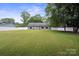 Large backyard with a well-maintained lawn and white fence, perfect for outdoor activities and privacy at 3807 Sweetgrass Ln, Charlotte, NC 28226