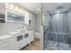 This bathroom features a stylish vanity, vessel sink, and a glass-enclosed shower with attractive tile work at 3807 Sweetgrass Ln, Charlotte, NC 28226