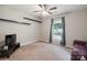 Bright, staged bedroom featuring an ample window, neutral walls, and a plush carpet at 3807 Sweetgrass Ln, Charlotte, NC 28226