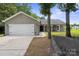Attractive ranch-style home with a welcoming front porch and attached two-car garage at 3807 Sweetgrass Ln, Charlotte, NC 28226