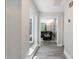 Inviting hallway with wood flooring and ample natural light leading to the living area at 3807 Sweetgrass Ln, Charlotte, NC 28226